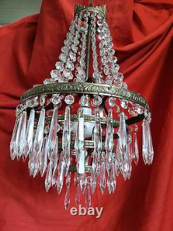A Chandelier With Pendant Frame In Bronze