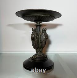 Antique Art Deco bronze bowl adorned with an African marabout holding a snake