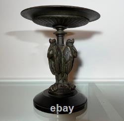 Antique Art Deco bronze bowl adorned with an African marabout holding a snake
