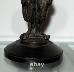 Antique Art Deco bronze bowl adorned with an African marabout holding a snake