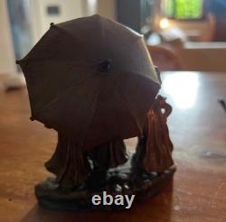 Antique Art Deco bronze statue depicting three little girls under an umbrella
