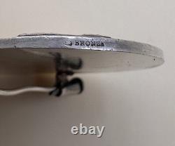 Art Deco Era, silvered bronze brooch, signed Jean Vernon
