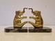 Art Deco Pair Of Elephant Bookends In Gilded Bronze And Stone From The 1930s