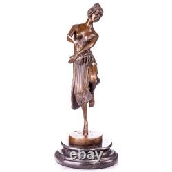 Art Deco bronze dancer sculpture on a black marble base, signed