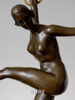 Art Deco bronze dancer sculpture with rings on a marble-effect base