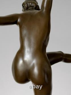 Art Deco bronze dancer sculpture with rings on a marble-effect base