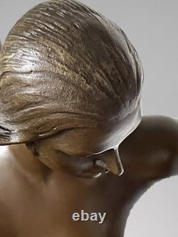 Art Deco bronze dancer sculpture with rings on a marble-effect base