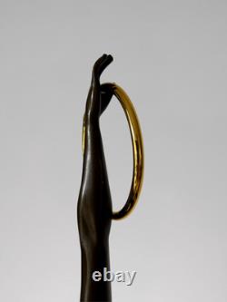 Art Deco bronze dancer sculpture with rings on a marble-effect base