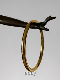 Art Deco bronze dancer sculpture with rings on a marble-effect base