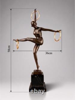 Art Deco bronze dancer sculpture with rings on a marble-effect base