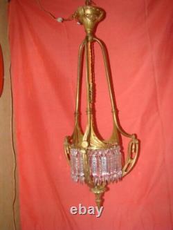 Art Deco era bronze chandelier adorned with cut crystal prisms