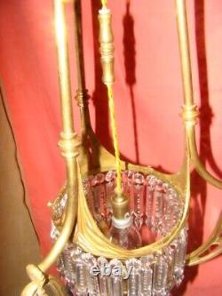 Art Deco era bronze chandelier adorned with cut crystal prisms