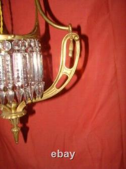 Art Deco era bronze chandelier adorned with cut crystal prisms