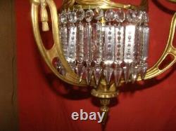 Art Deco era bronze chandelier adorned with cut crystal prisms