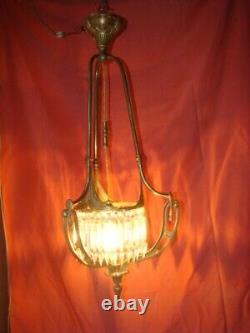 Art Deco era bronze chandelier adorned with cut crystal prisms