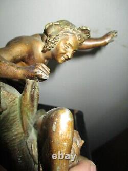 Bronze patina regule statuette of a faun undressing a nymph ART DECO