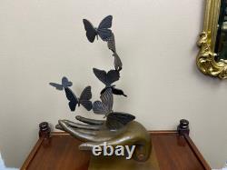 Bronze sculpture of a hand releasing butterflies, Art Deco, signed