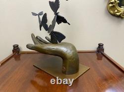 Bronze sculpture of a hand releasing butterflies, Art Deco, signed