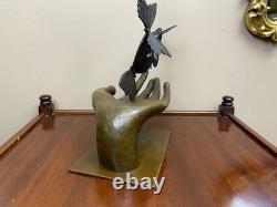 Bronze sculpture of a hand releasing butterflies, Art Deco, signed