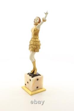 Bronze sculpture of a lady mounted on an Art Deco-style dice-shaped base, signed