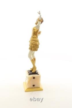 Bronze sculpture of a lady mounted on an Art Deco-style dice-shaped base, signed