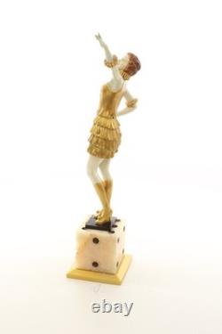 Bronze sculpture of a lady mounted on an Art Deco-style dice-shaped base, signed