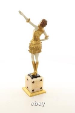 Bronze sculpture of a lady mounted on an Art Deco-style dice-shaped base, signed