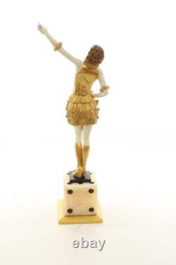 Bronze sculpture of a lady mounted on an Art Deco-style dice-shaped base, signed