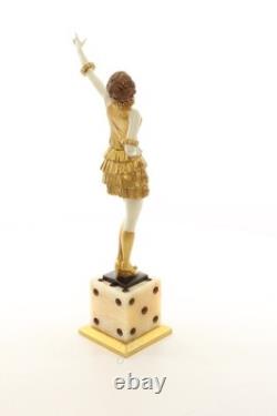 Bronze sculpture of a lady mounted on an Art Deco-style dice-shaped base, signed