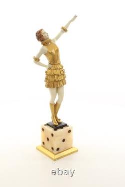 Bronze sculpture of a lady mounted on an Art Deco-style dice-shaped base, signed