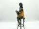 Colored Sculpture Of A Lady On A Bar Stool Art Deco After Pierre Collinet