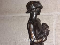 Elegant woman bronze statuette with little dog, 1920s Art Deco style, Roaring Twenties