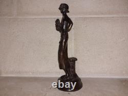Elegant woman bronze statuette with little dog, 1920s Art Deco style, Roaring Twenties
