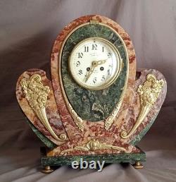 Exceptional and rare Art Deco clock in gilded bronze and Persian red marble
