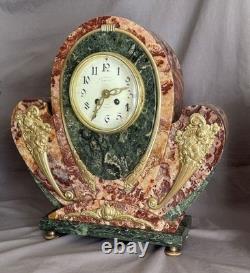 Exceptional and rare Art Deco clock in gilded bronze and Persian red marble