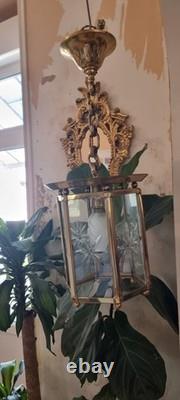 French Art Deco bronze chandelier in a hexagonal shape with six thick cut glass panels