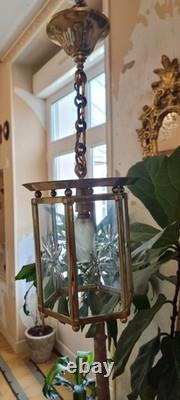 French Art Deco bronze chandelier in a hexagonal shape with six thick cut glass panels
