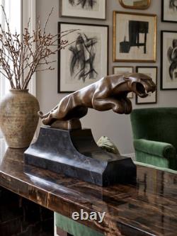 Large Art Deco Jaguar sculpture in patinated bronze on an architectural black base
