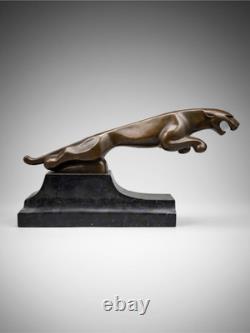 Large Art Deco Jaguar sculpture in patinated bronze on an architectural black base