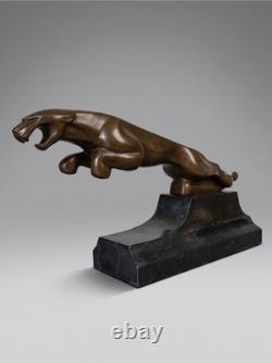 Large Art Deco Jaguar sculpture in patinated bronze on an architectural black base