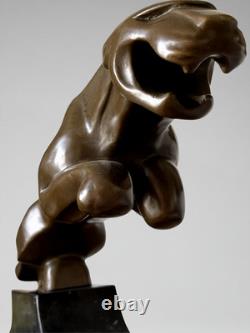 Large Art Deco Jaguar sculpture in patinated bronze on an architectural black base