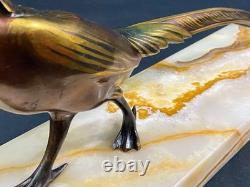 Large subject of a pheasant in iridescent bronze on an onyx terrace, Art Deco period