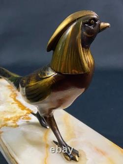 Large subject of an iridescent bronze pheasant on an onyx terrace, Art Deco period