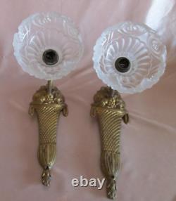Pair of Art Deco bronze wall sconces with white satin glass tulips.