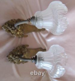 Pair of Art Deco bronze wall sconces with white satin glass tulips.