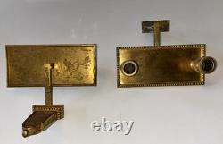 Pair of Art Deco wall sconces in gilded bronze with two lights