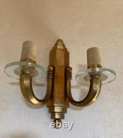 Pair of gilt bronze wall sconces with crystal glass discs Art Deco horn steps 1930
