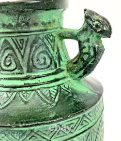 Vintage Japanese bronze vase in archaic style with relief motif, antique Art Deco style