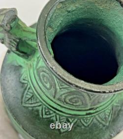 Vintage Japanese bronze vase in archaic style with relief motif, antique Art Deco style