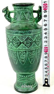 Vintage Japanese bronze vase in archaic style with relief motif, antique Art Deco style